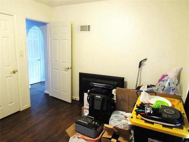 miscellaneous room featuring dark hardwood / wood-style floors