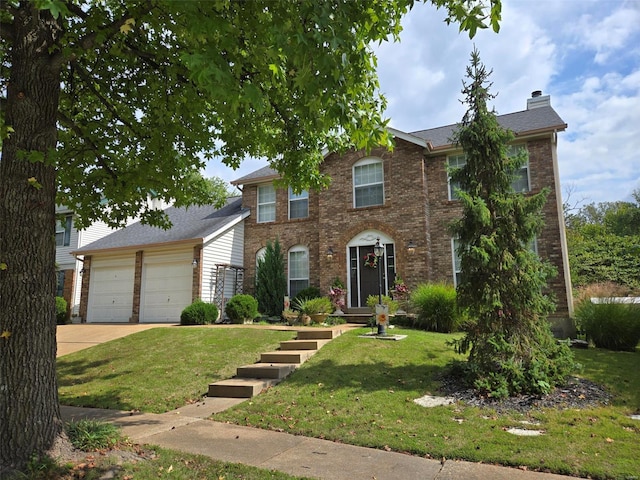 colonial-style house featuring brick siding, driveway, a chimney, and a front yard