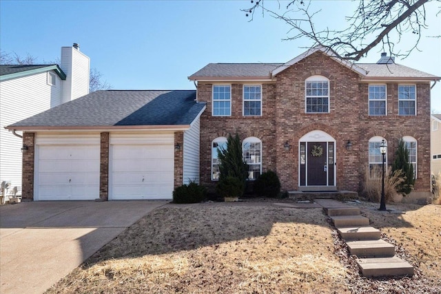 colonial house with brick siding, driveway, a shingled roof, and a garage