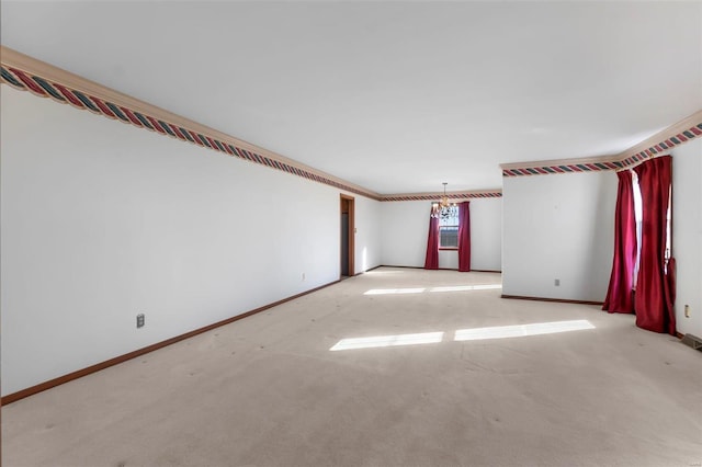 unfurnished room with light carpet and a notable chandelier