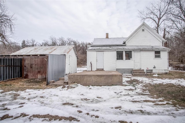 view of snow covered house