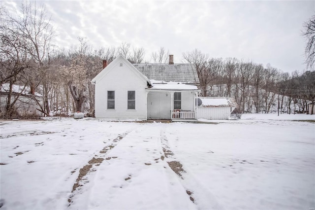 view of snow covered house