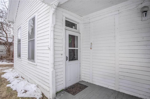 view of snow covered property entrance