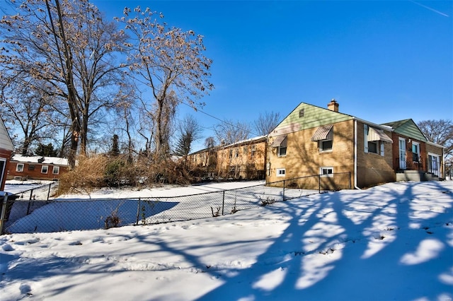 view of yard layered in snow