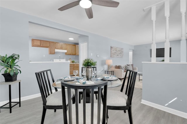 dining space featuring ceiling fan and light hardwood / wood-style floors