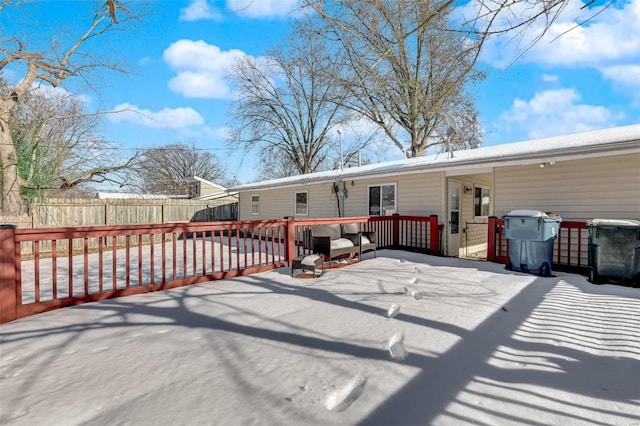 rear view of property with a wooden deck