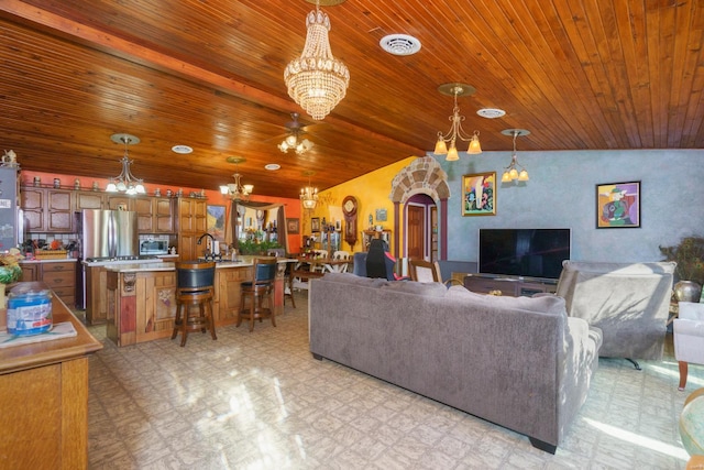 living room with ceiling fan and lofted ceiling