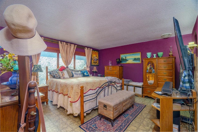 bedroom featuring a textured ceiling