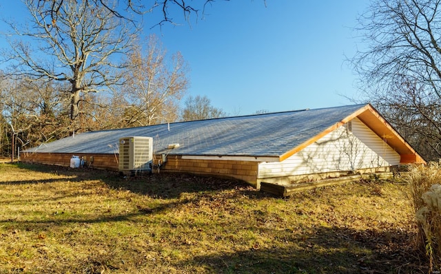 view of property exterior with a yard