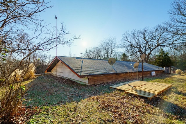 view of property exterior with central AC