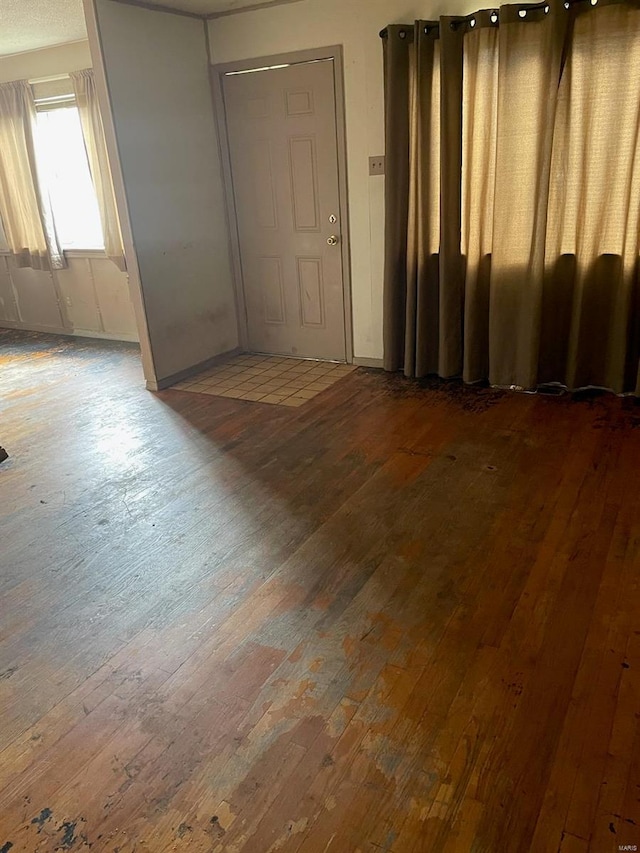 empty room featuring dark wood-type flooring