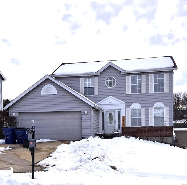 view of front of property with a garage