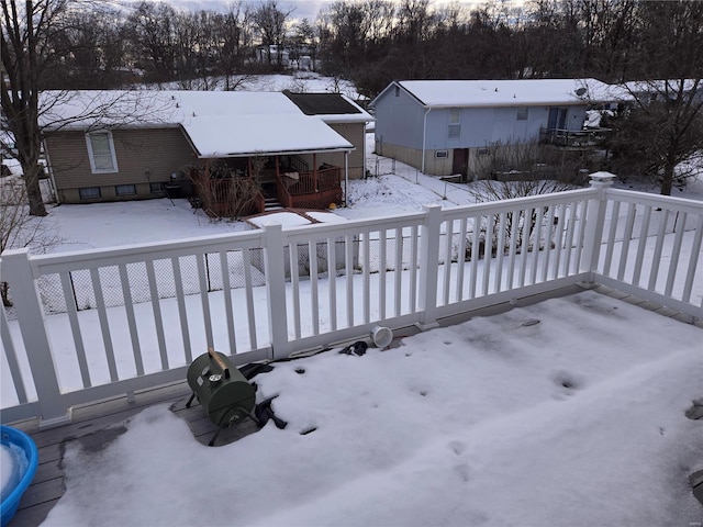 view of snow covered deck