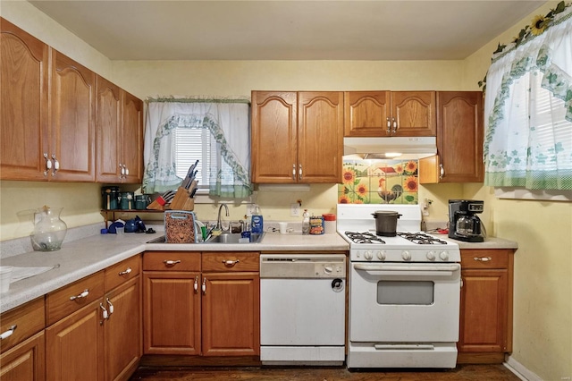 kitchen featuring sink and white appliances