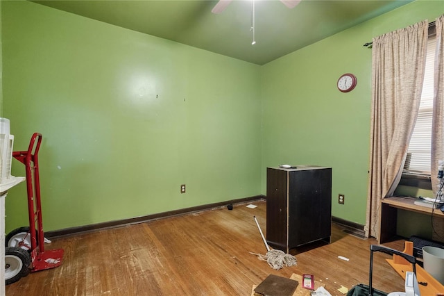 office area with hardwood / wood-style flooring and ceiling fan