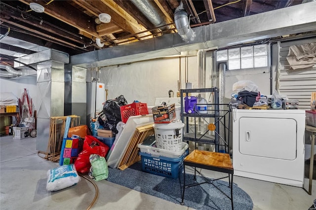 basement featuring water heater and washer / dryer