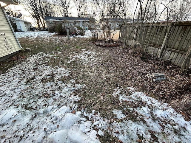 view of yard covered in snow