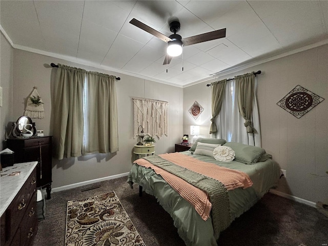 carpeted bedroom featuring ceiling fan and ornamental molding