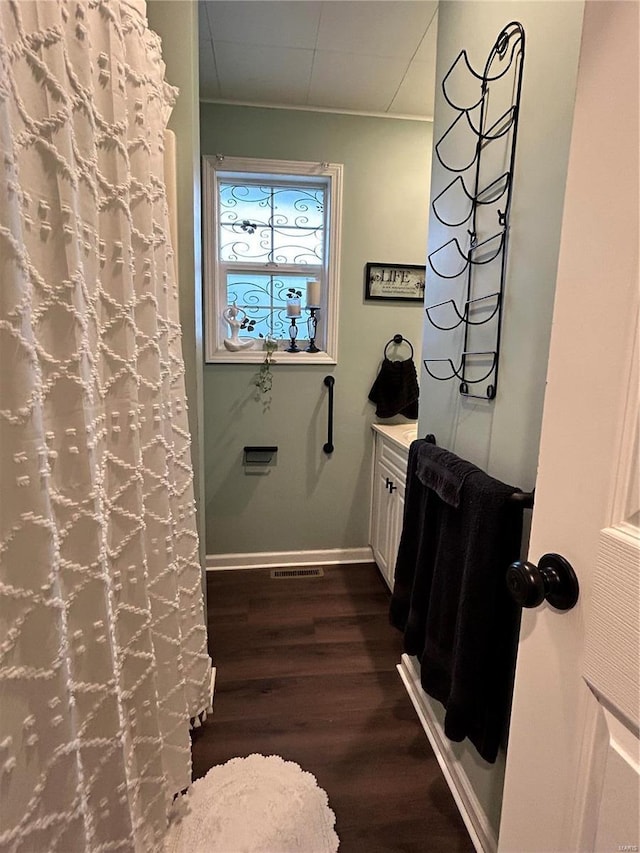 bathroom with wood-type flooring