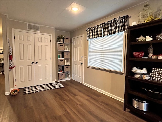 foyer with dark hardwood / wood-style flooring