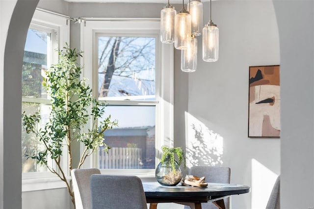 dining space featuring a notable chandelier