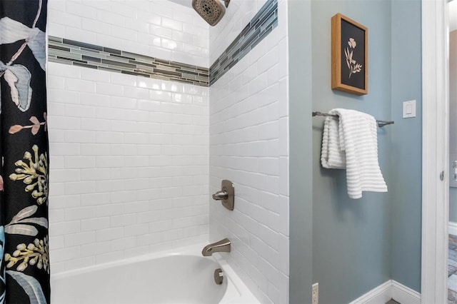 bathroom with shower / bathtub combination with curtain