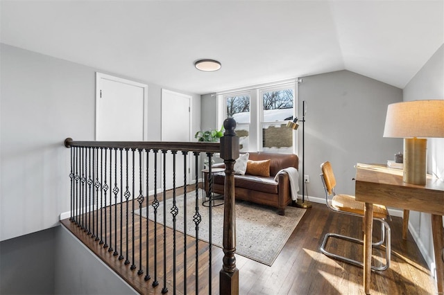 living area with dark wood-type flooring and lofted ceiling