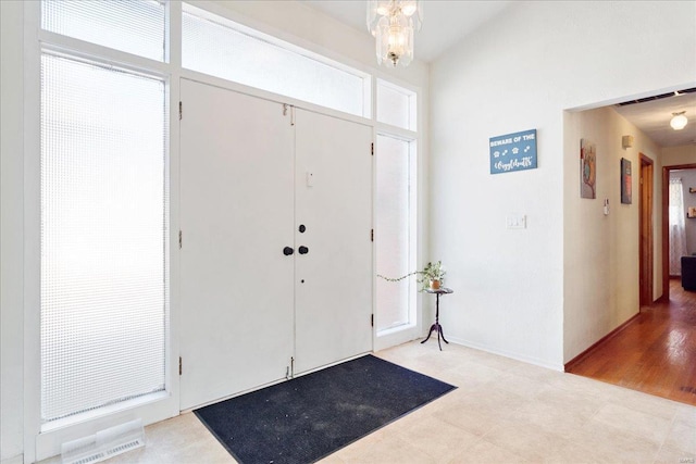 foyer featuring plenty of natural light