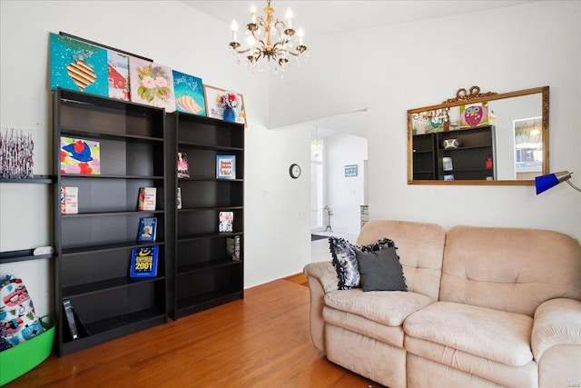 living room featuring hardwood / wood-style floors and a notable chandelier