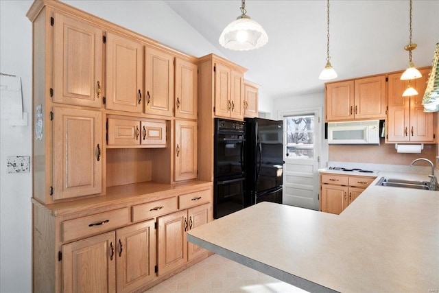 kitchen featuring black appliances, sink, light brown cabinets, and pendant lighting