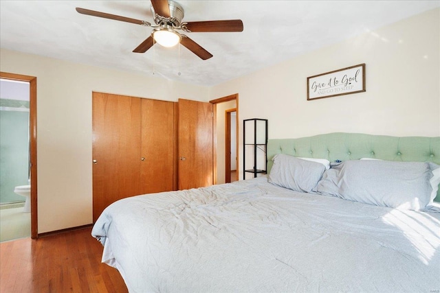 bedroom featuring ceiling fan, connected bathroom, and wood-type flooring