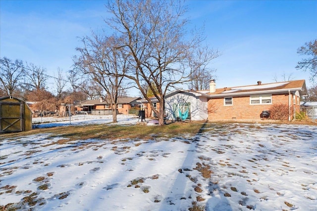 view of yard covered in snow