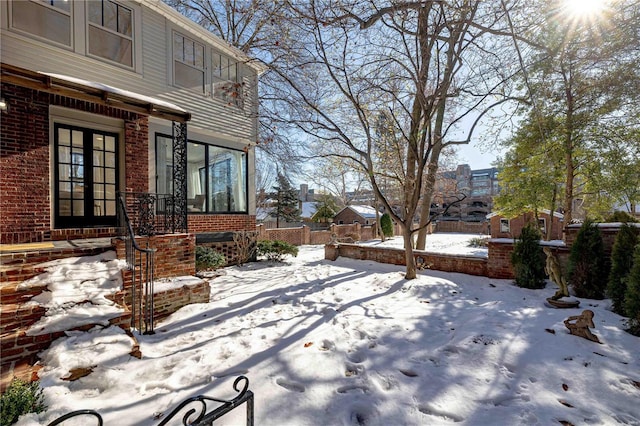 view of yard layered in snow