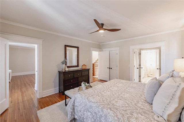 bedroom with ceiling fan, ensuite bathroom, light hardwood / wood-style flooring, and crown molding