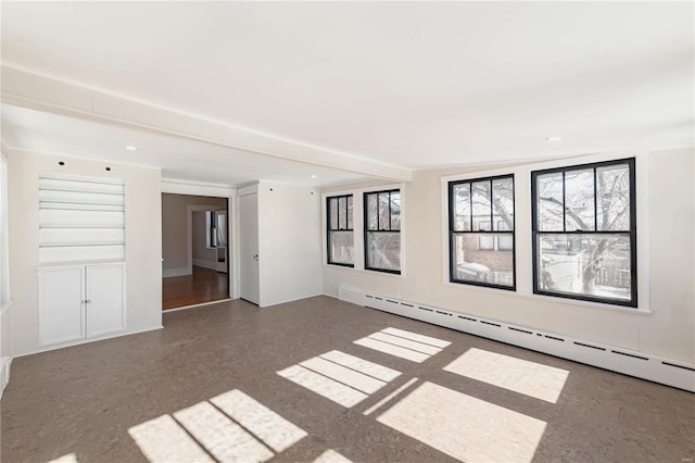 empty room featuring a baseboard radiator