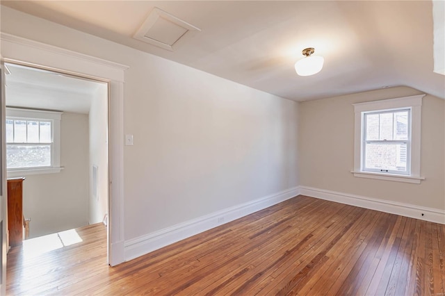 unfurnished room with wood-type flooring