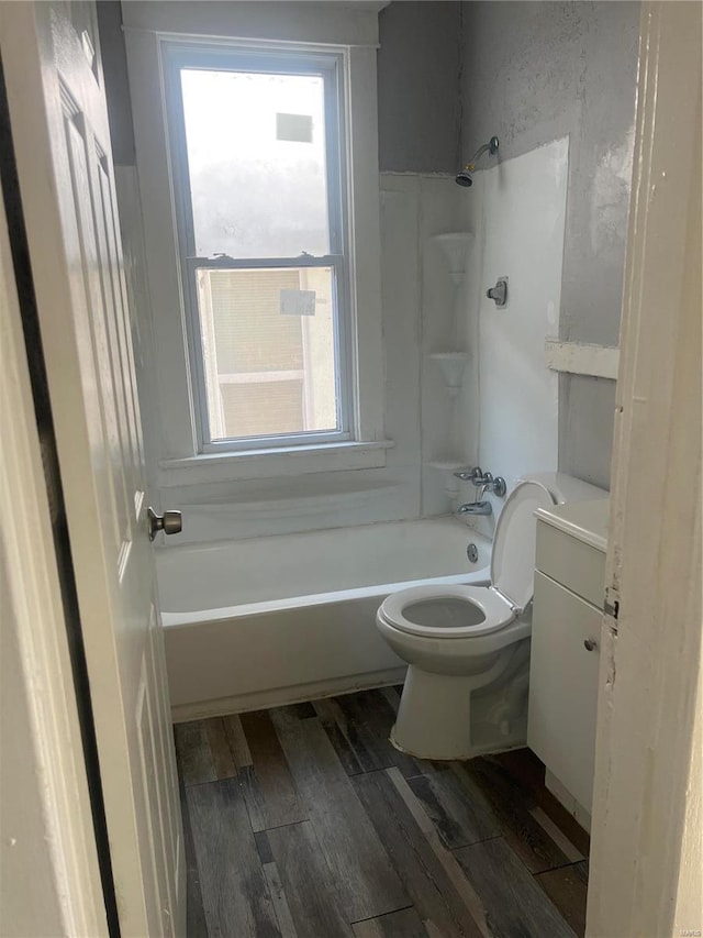 full bathroom with toilet, vanity, shower / washtub combination, and hardwood / wood-style floors