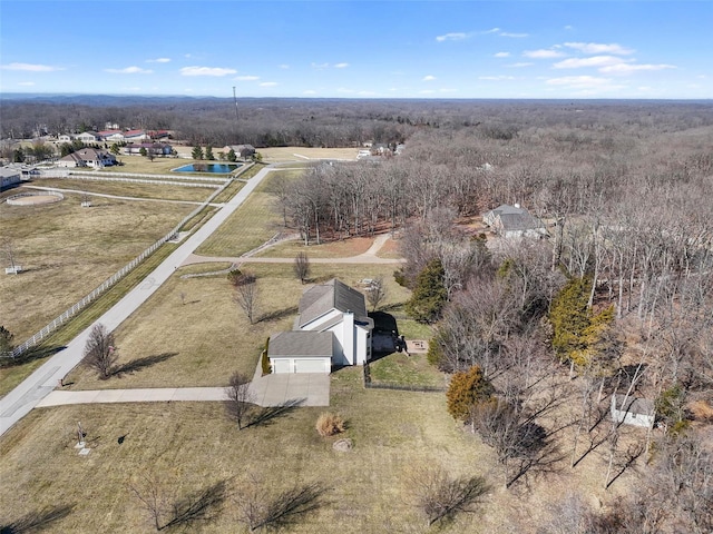 birds eye view of property with a rural view