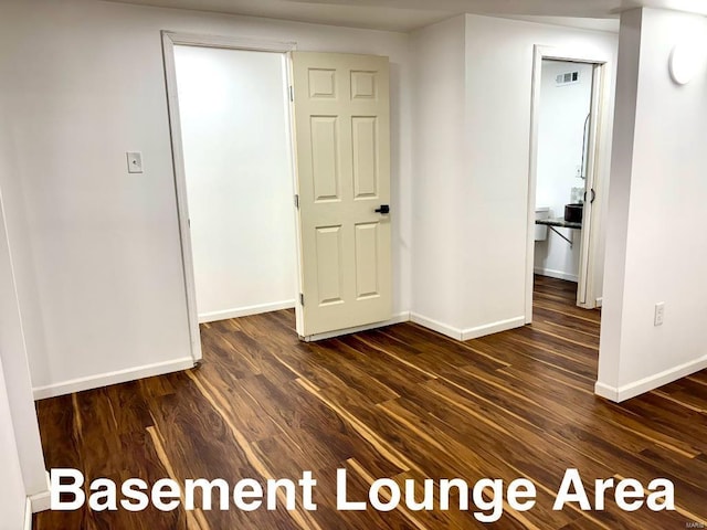 unfurnished room featuring dark hardwood / wood-style floors