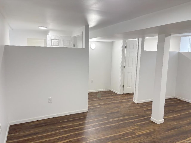 basement featuring dark hardwood / wood-style flooring