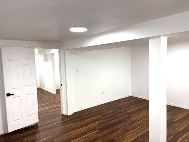 basement featuring dark wood-type flooring