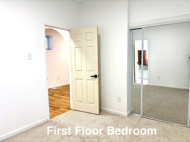 unfurnished bedroom with carpet floors and a closet