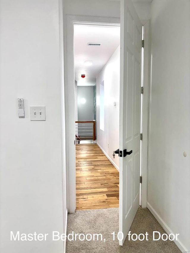 hallway featuring carpet floors