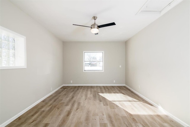 spare room featuring light hardwood / wood-style floors and ceiling fan