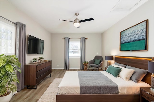 bedroom featuring ceiling fan and light hardwood / wood-style flooring