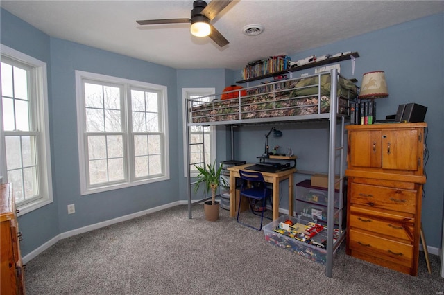 bedroom featuring carpet floors, a textured ceiling, and ceiling fan