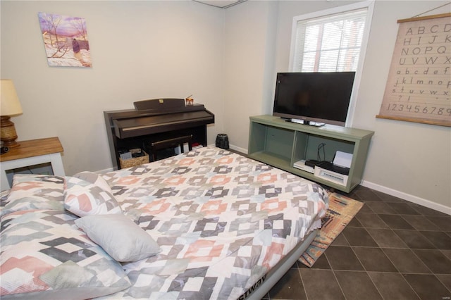 bedroom featuring dark tile patterned flooring