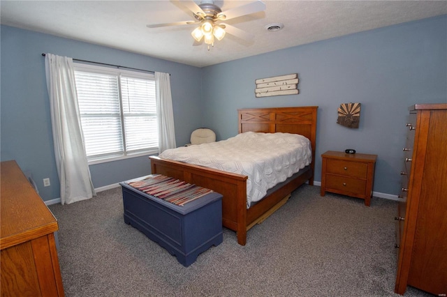 bedroom with carpet flooring, visible vents, baseboards, and ceiling fan