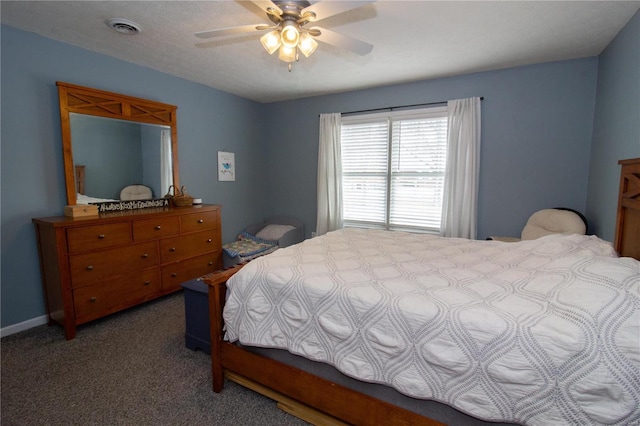 bedroom featuring visible vents, a ceiling fan, and carpet
