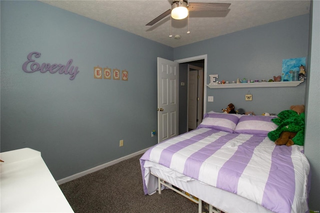 bedroom featuring a textured ceiling, ceiling fan, baseboards, and carpet